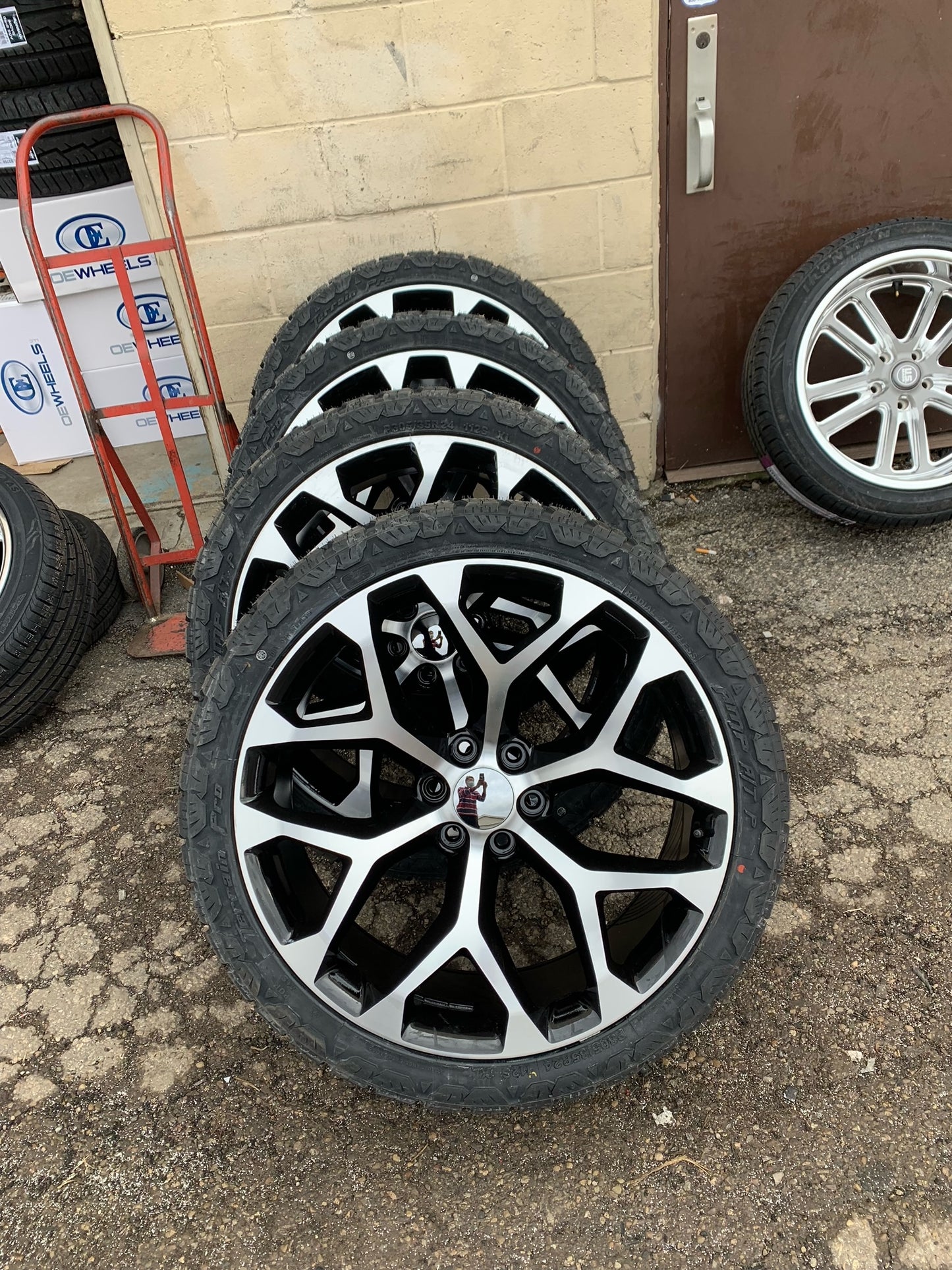 Chevy 6 Lug Black and Machine with Amp Tires 305/35/24