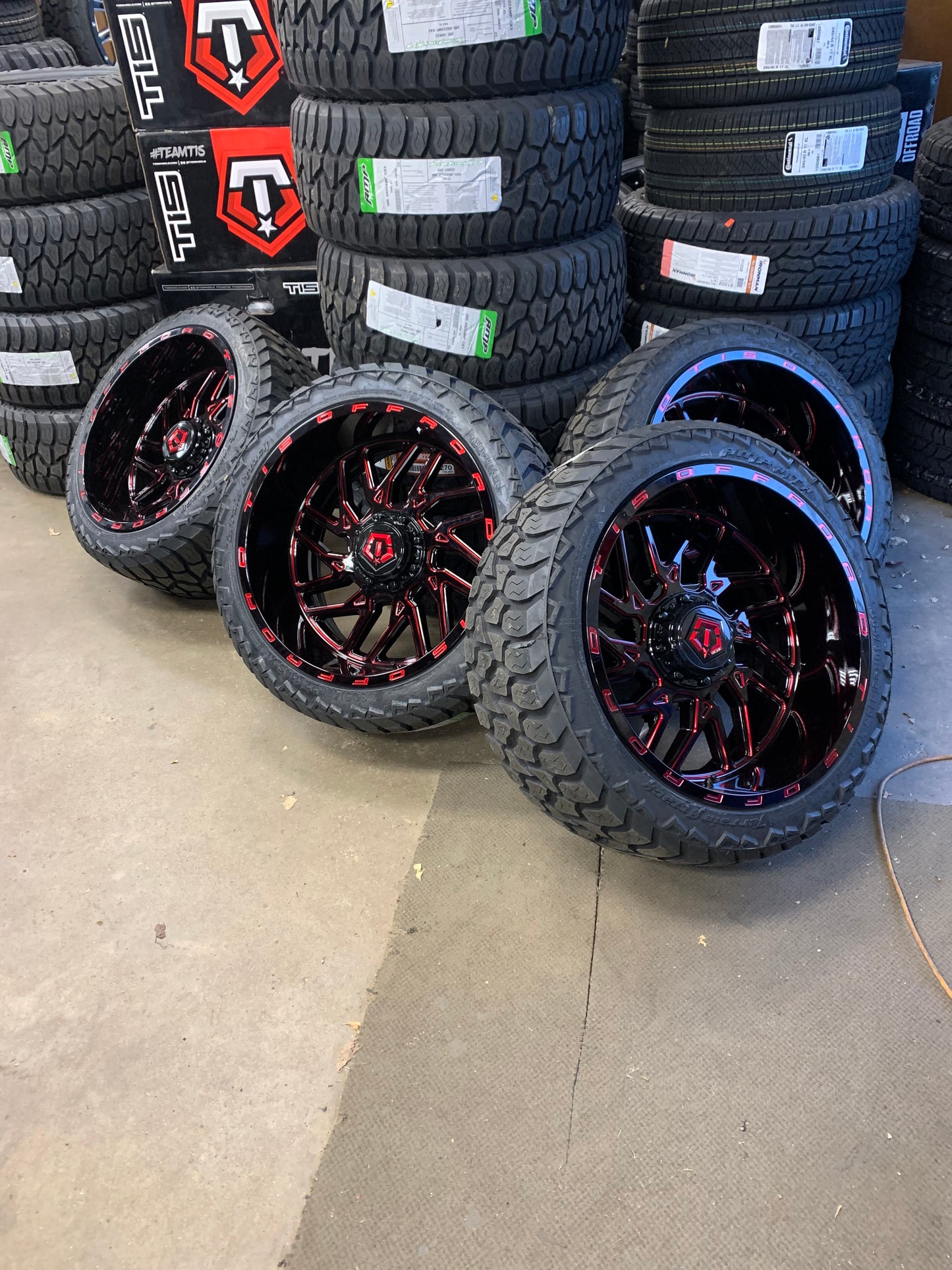 TIS 22x12 Black and Red -44mm Offset 6x5.5 Chevy 6 Lug with AMP 305/35/24 All Terrain Tires