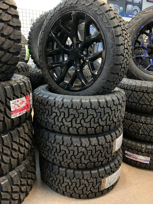22" Black Snowflake Chevy GMC Cadillac with AMP 285/45/22 All Terrain Tires