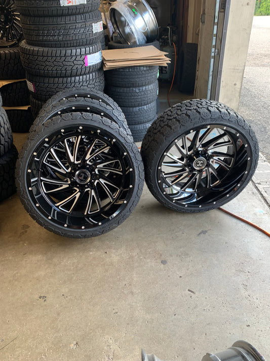 Hardcore 24" 8x180 Black and Milled with 305/35/24 AMP All Terrain Tires