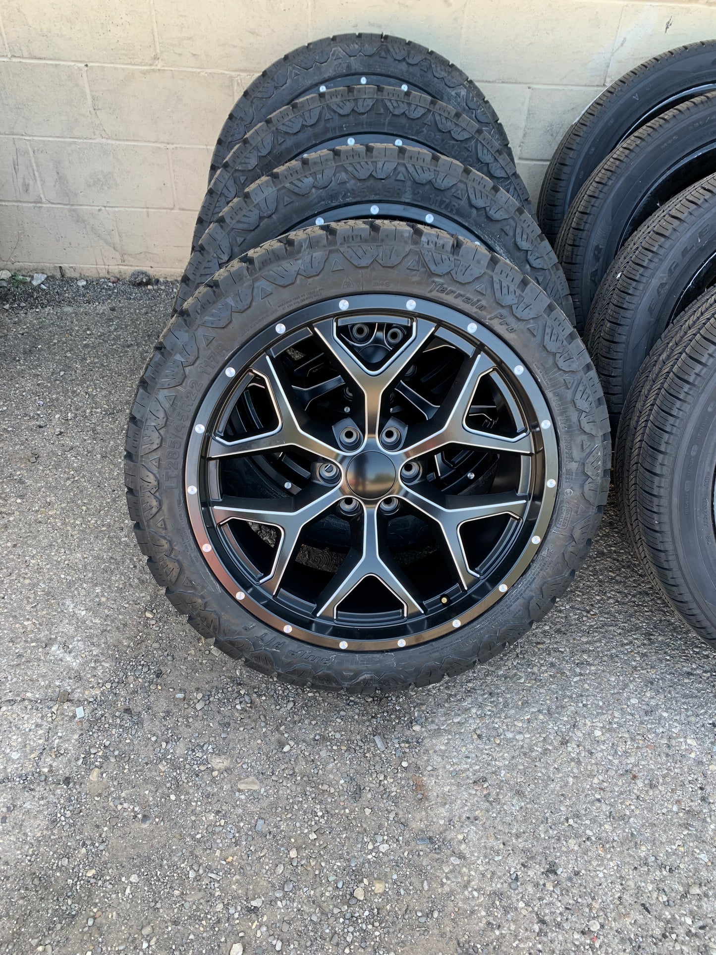 22" Snowflake Black And Milled Chevy Dodge GMC 6 Lug with 285/45/22 All Terrain Tires