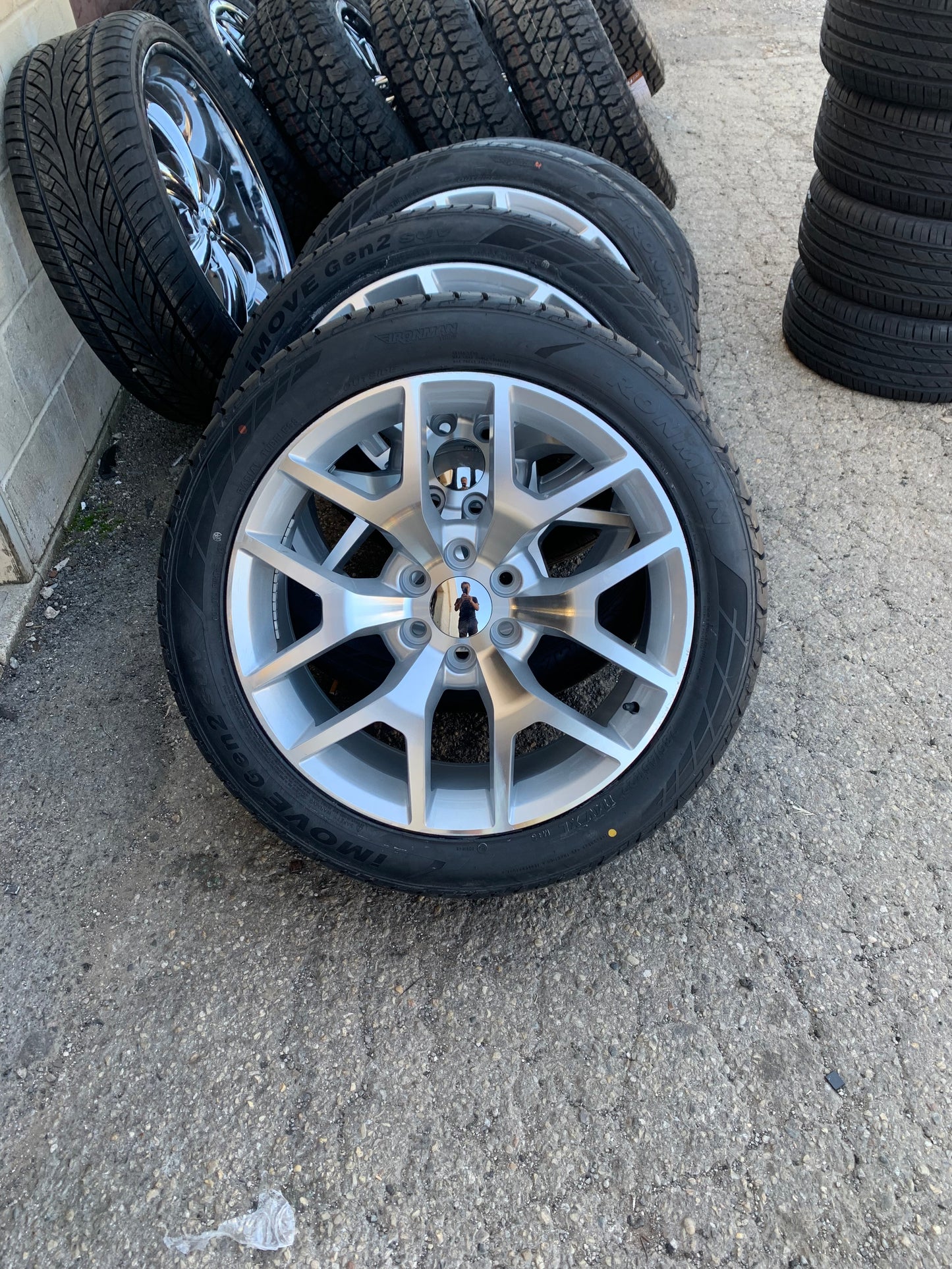 22" Snowflake Silver And Brush Chevy Dodge GMC 6 Lug with 285/45/22 All Season Tires